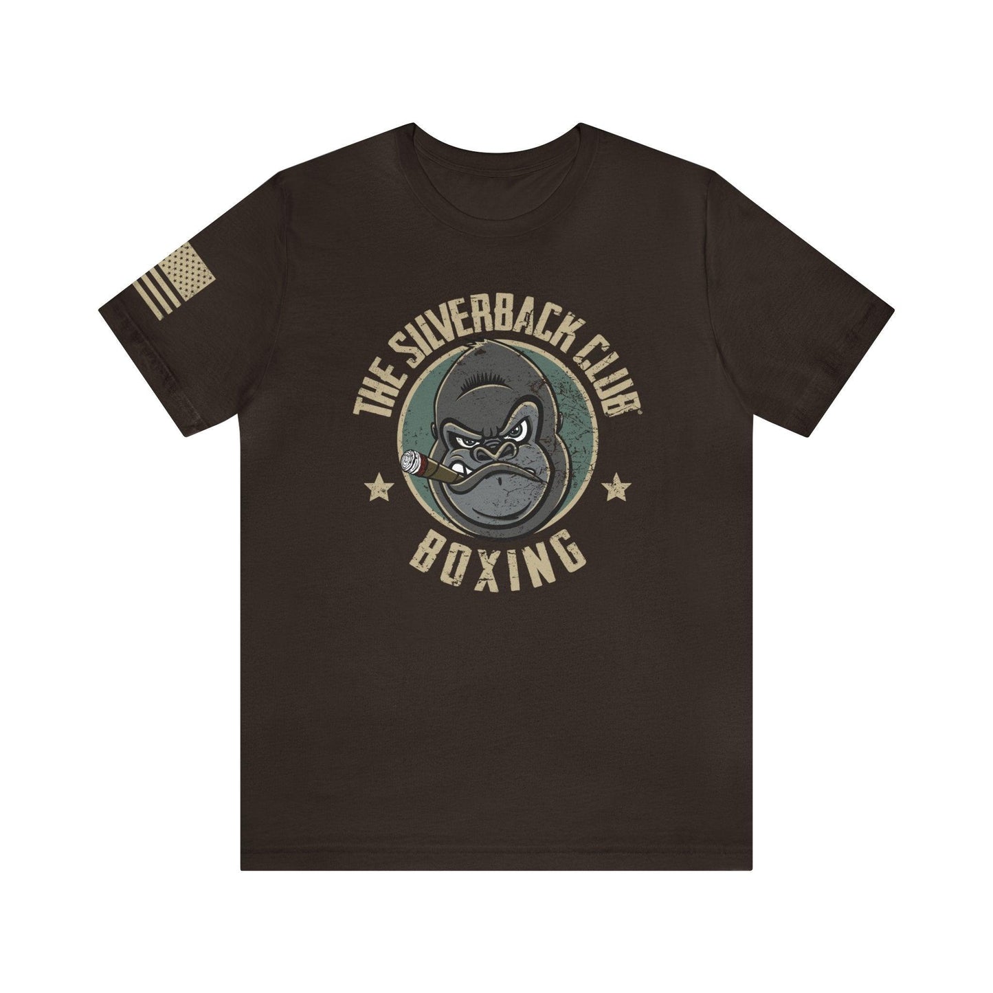 The front of a brown t-shirt and The Silverback Club logo consisting of a gorilla's face smoking a cigar and the words "Boxing" underneath. The U.S. flag is on the right sleeve.