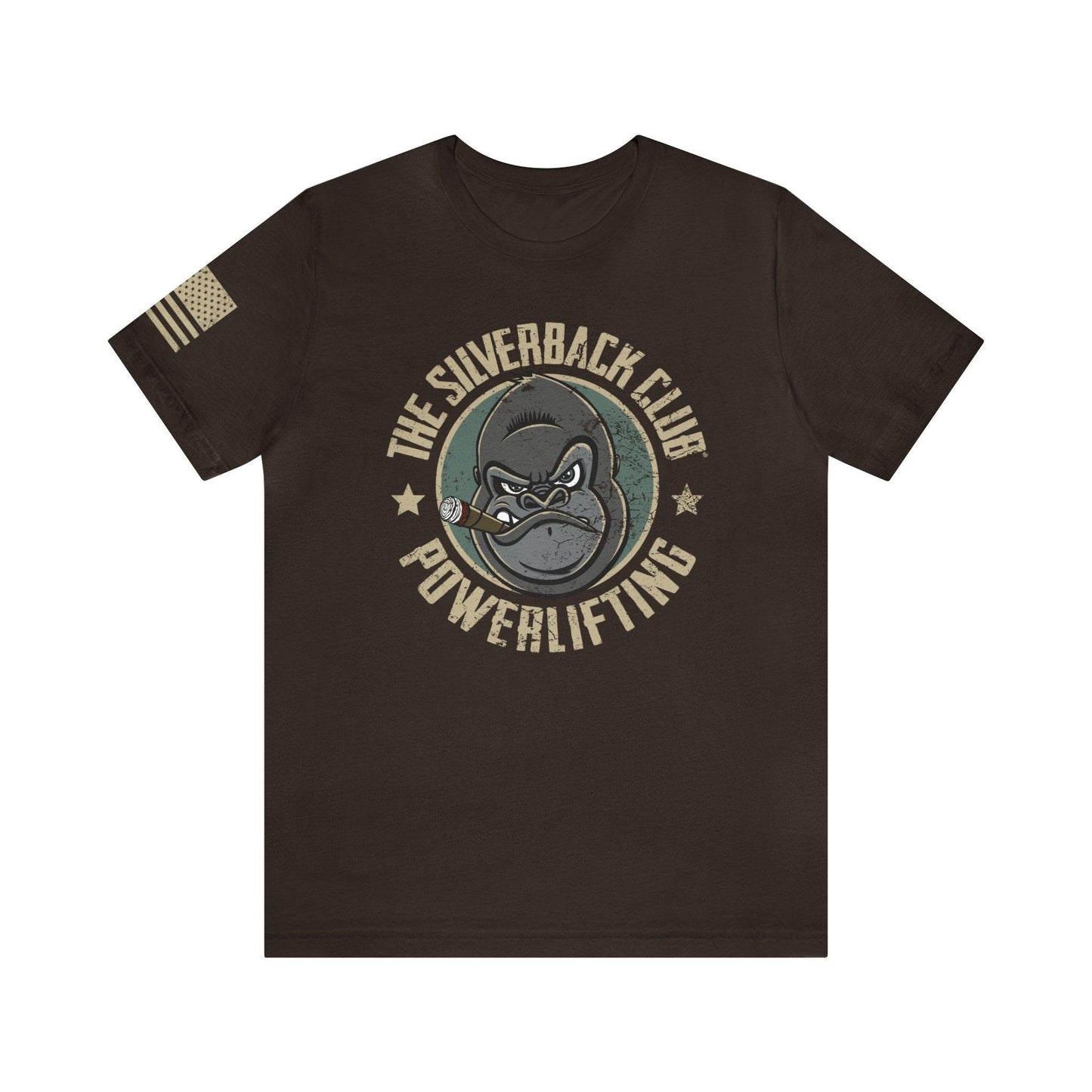 The front of a brown t-shirt and The Silverback Club logo consisting of a gorilla's face smoking a cigar and the words "Powerlifting" underneath.